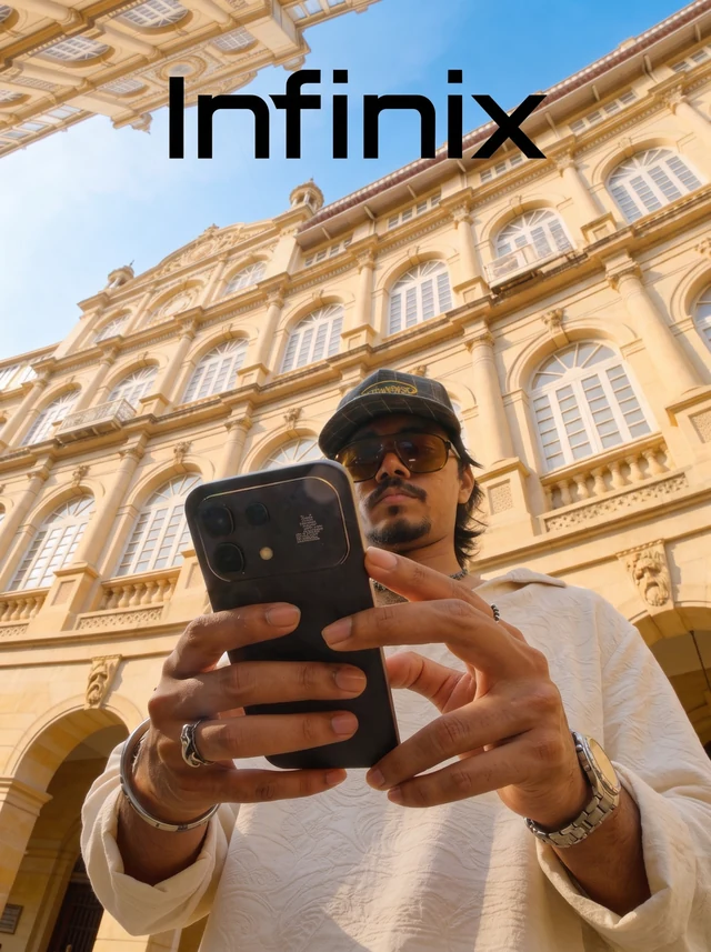 Infinix-branded image of a person holding a phone in front of an ornate building.